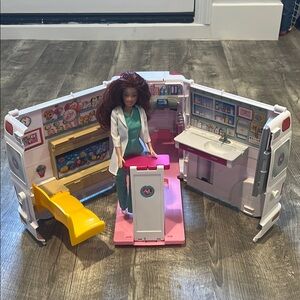 Barbie ambulance with doctor doll.